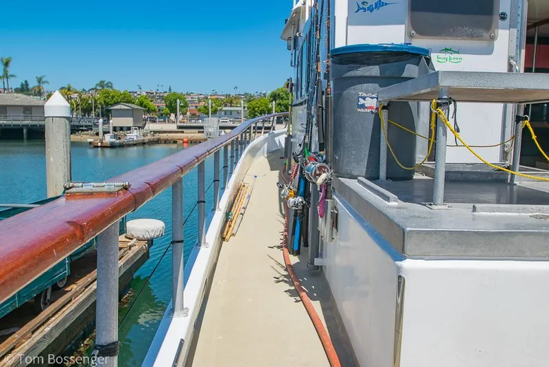 Slide: The Image of 1975 Blanchard Passenger Sportfisher docked, showing deck and marina view. - 19