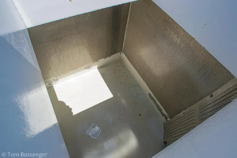 Slide: The Image of Empty storage compartment on a 1975 Blanchard Passenger Sportfisher boat. - 30
