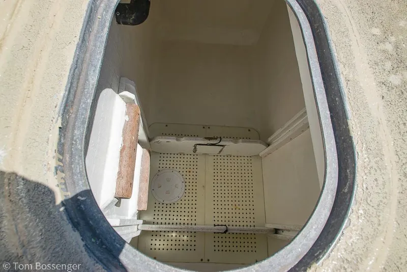 Slide: The Image of 1975 Blanchard Passenger Sportfisher storage compartment with open hatch and interior view. - 34