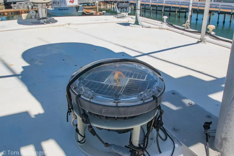 Slide: The Image of 1975 Blanchard Passenger Sportfisher deck with marine light, docked at harbor. - 40