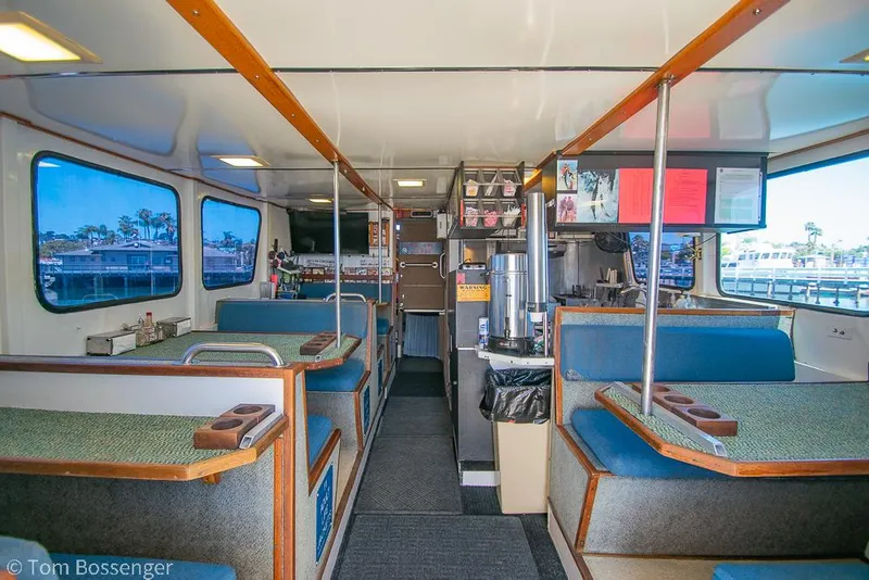 Slide: The Image of Interior of a 1975 Blanchard Passenger Sportfisher with seating and dining area. - 46