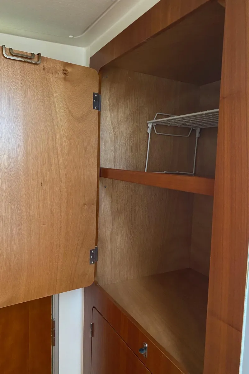 Slide: The Image of Stainless steel three-burner stove on PDQ MV-41, 2008 model, in a compact kitchen setting. - 25