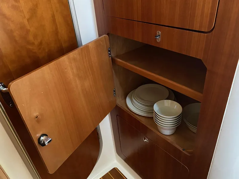 Slide: The Image of Open wooden cabinet with shelves inside, PDQ MV-41, 2008 model. - 26