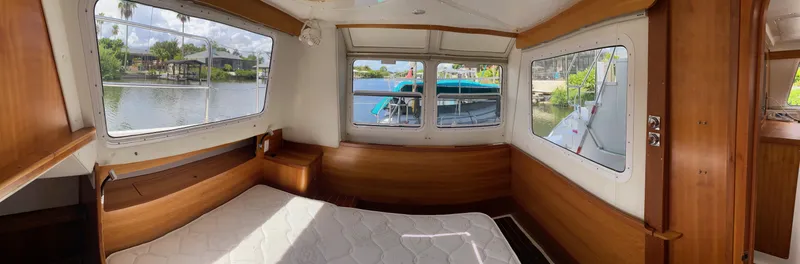 Slide: The Image of Cozy bedroom in 2008 PDQ MV-41 boat with floral bedding and large windows. - 31