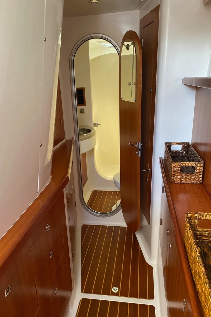 Slide: The Image of Luxurious interior of 2008 PDQ MV-41 yacht with wooden cabinetry and wicker baskets. - 34