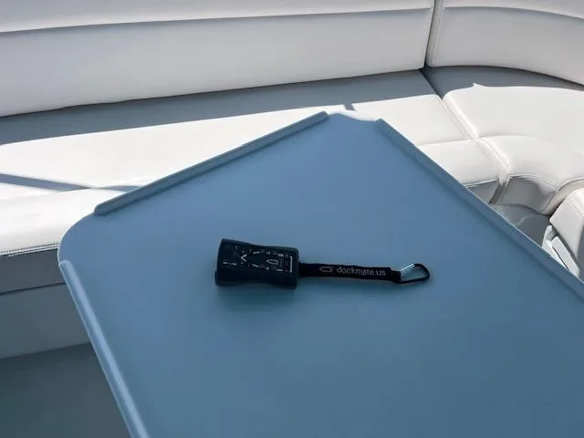 Slide: The Image of 2008 PDQ MV-41 boat interior with steering wheel and seating, dockside view. - 49