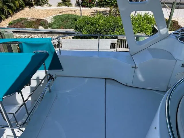 Slide: The Image of White captain's chairs and steering wheel on a 2008 PDQ MV-41 boat. - 53