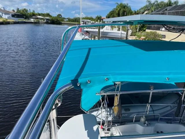 Slide: The Image of Upper deck of 2008 PDQ MV-41 boat with teal canopy and railing. - 55
