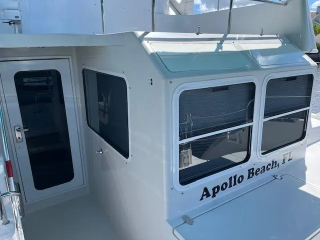 Slide: The Image of 2008 PDQ MV-41 boat with turquoise canopy on a calm river. - 57