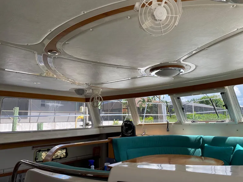 Slide: The Image of Interior of 2008 PDQ MV-41 yacht with teal seating and modern design. - 7