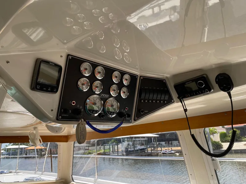 Slide: The Image of Control panel of a 2008 PDQ MV-41 boat with gauges and navigation equipment. - 9