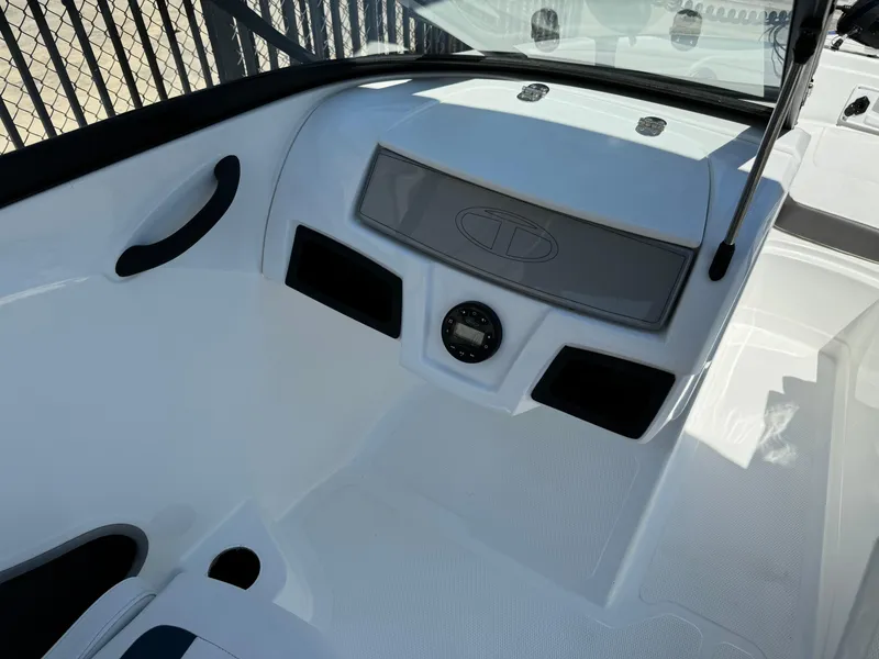 Slide: The Image of 2021 Tracker Tahoe 450 TF boat interior, white and black design. - 10