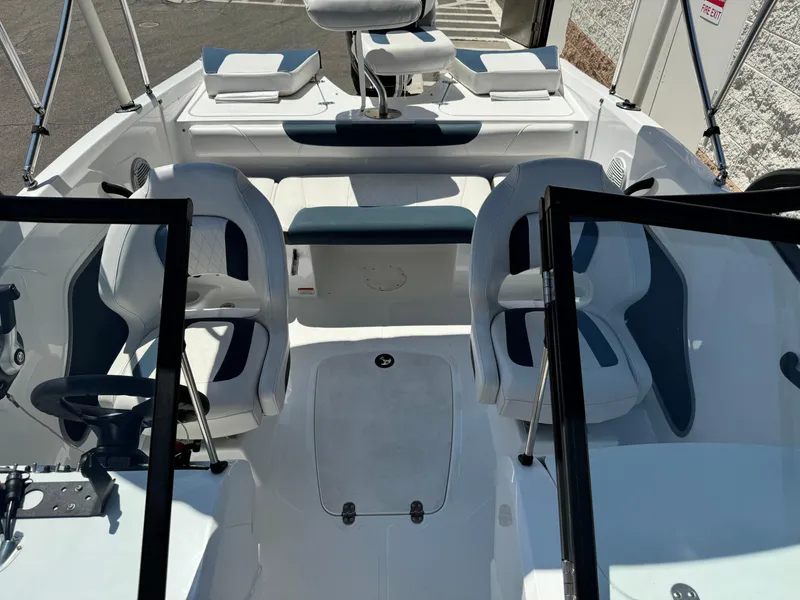 Slide: The Image of 2021 Tracker Tahoe 450 TF boat interior with seating and steering wheel. - 13