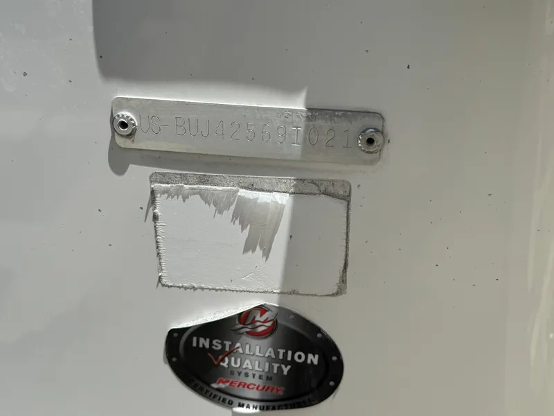 Slide: The Image of 2021 Tracker Tahoe 450 TF boat identification plate and installation quality sticker. - 16