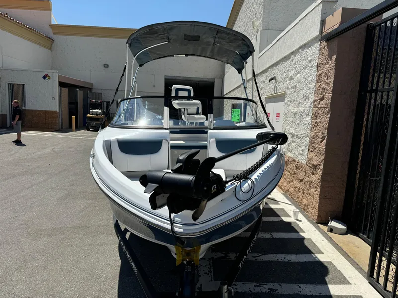 Slide: The Image of 2021 Tracker Tahoe 450 TF boat parked outdoors. - 3