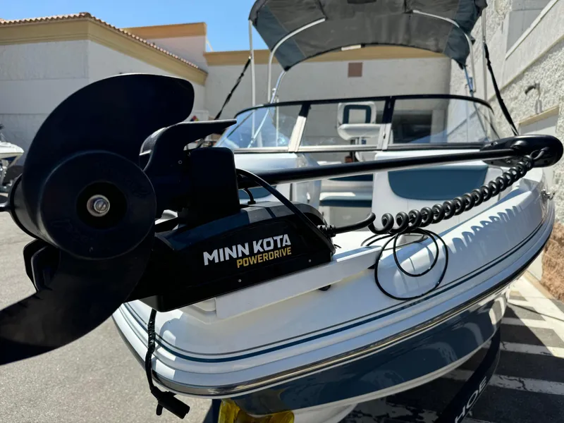 Slide: The Image of 2021 Tracker Tahoe 450 TF boat with Minn Kota PowerDrive trolling motor. - 5