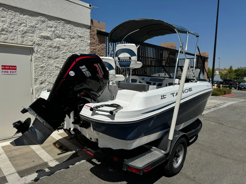 Slide: The Image of 2021 Tracker Tahoe 450 TF boat on a trailer with a Mercury 115 outboard motor. - 7