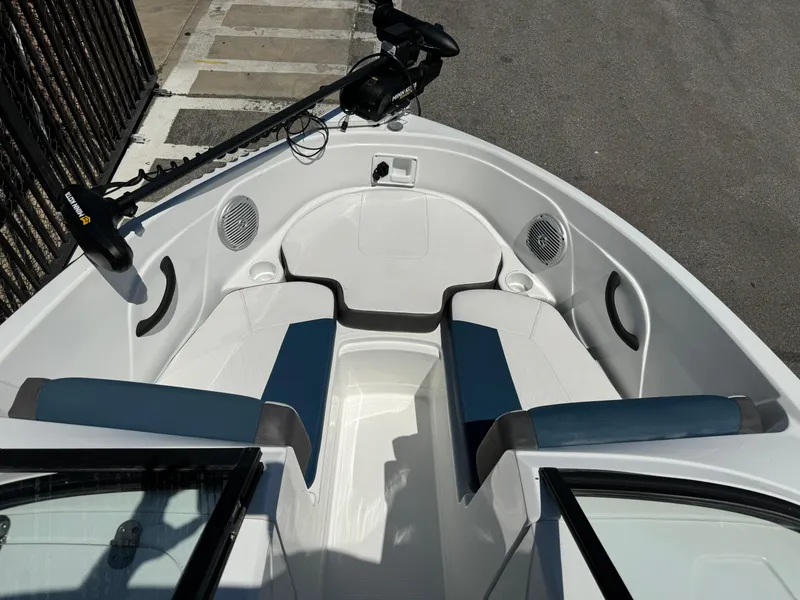 Slide: The Image of 2021 Tracker Tahoe 450 TF boat interior with seating and trolling motor. - 9