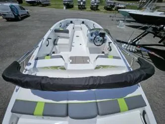 Slide: The Image of 2022 Tahoe T18 boat interior with seating and steering console. - 2