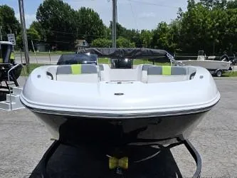 Slide: The Image of 2022 Tahoe T18 boat on display outdoors. - 4