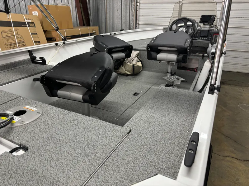 Slide: The Image of 2021 Crestliner 1650 Discovery SC fishing boat interior with seats and control panel. - 10