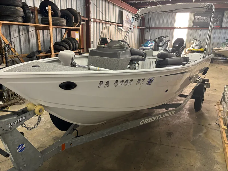 Slide: The Image of 2021 Crestliner 1650 Discovery SC boat on trailer in a storage facility. - 8