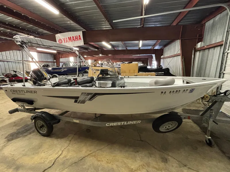 Slide: The Image of 2021 Crestliner 1650 Discovery SC boat on trailer in indoor storage. - 9