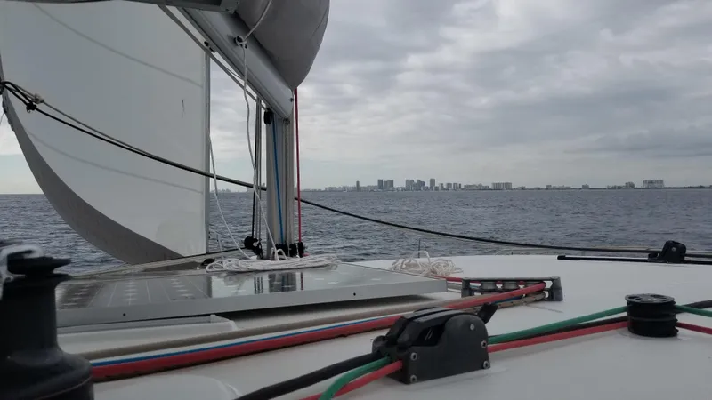 Slide: The Image of Sailing on a 2010 Lagoon 400 catamaran with city skyline in the distance. - 20