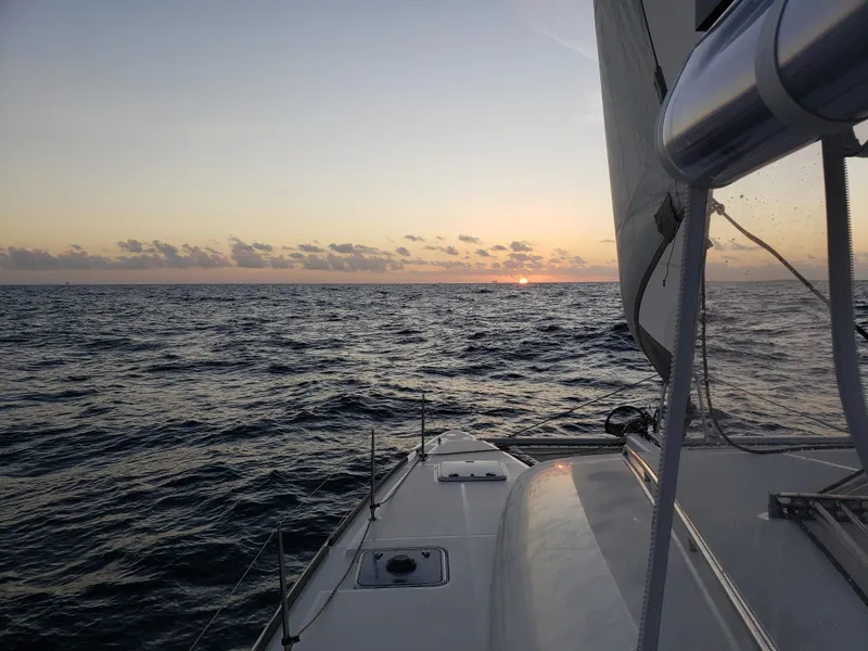 Slide: The Image of Lagoon 400 sailboat at sunset on the ocean, 2010 model. - 21