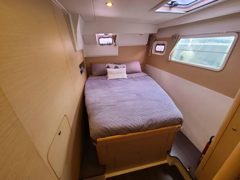 Slide: The Image of Cozy bedroom in 2010 Lagoon 400 owner's version catamaran with natural light and modern design. - 38
