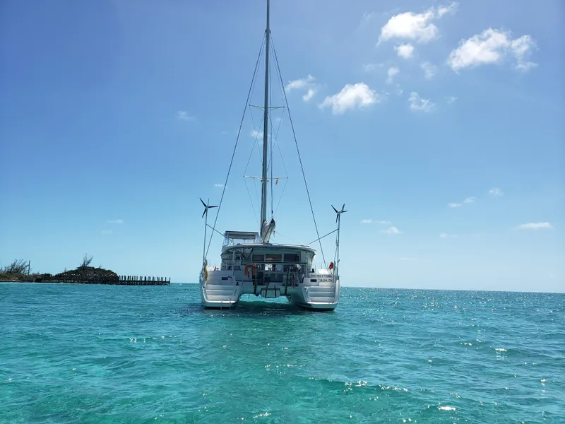 Slide: The Image of Lagoon 400 catamaran sailing on clear blue waters under a sunny sky, 2010 model. - 9