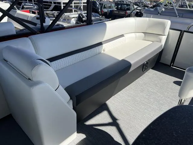 Slide: The Image of 2024 Godfrey Pontoons SW2486MT interior seating area with white and gray upholstery. - 10