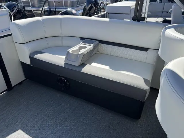 Slide: The Image of 2024 Godfrey Pontoons SW2486MT interior seating with cup holders. - 11
