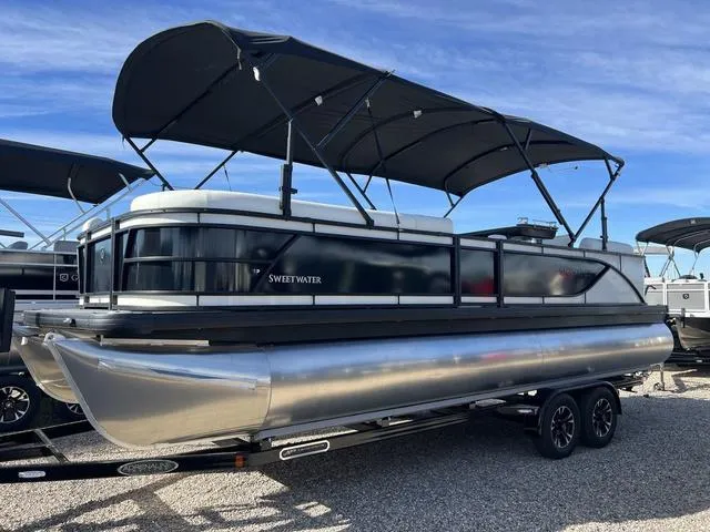 Slide: The Image of 2024 Godfrey Pontoons SW2486MT Sweetwater pontoon boat with dual bimini tops on a trailer. - 3