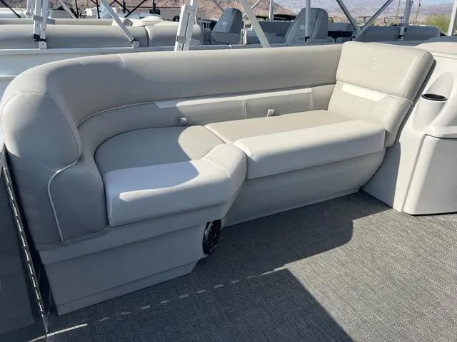 Slide: The Image of 2025 Godfrey Pontoons EX2286SBX interior seating, gray upholstery, spacious and comfortable design. - 3