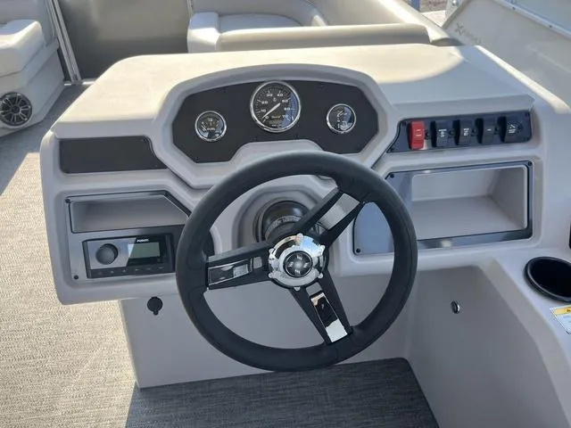 Slide: The Image of 2025 Godfrey Pontoons EX2286SBX steering console with gauges and controls. - 7