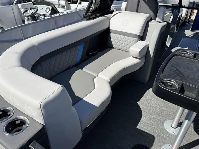 Slide: The Image of 2023 Godfrey Pontoons AquaPatio 256 SBW Twin interior seating and console. - 12