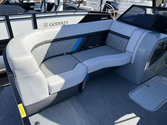 Slide: The Image of 2023 Godfrey AquaPatio 256 SBW Twin pontoon boat interior with luxurious seating. - 5