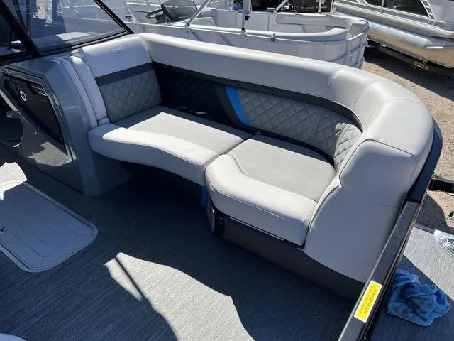 Slide: The Image of 2023 Godfrey Pontoons AquaPatio 256 SBW Twin interior seating area with gray upholstery. - 6