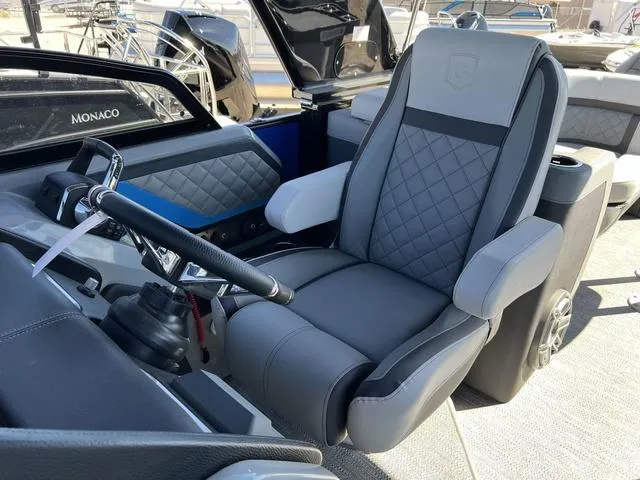 Slide: The Image of 2023 Godfrey Pontoons AquaPatio 256 SBW Twin captain's chair and helm station. - 8