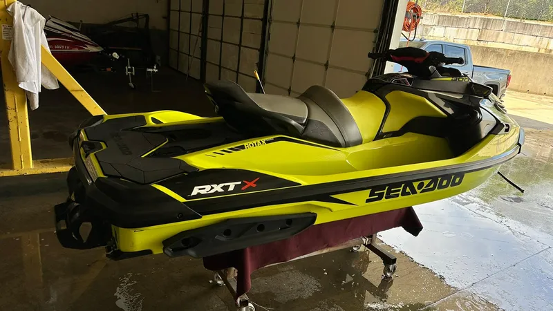 Slide: The Image of 2018 Sea-Doo RXT-X 300 jet ski in a garage. - 3