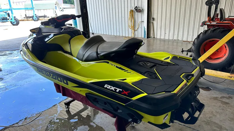 Slide: The Image of 2018 Sea-Doo RXT-X 300 jet ski in a garage. - 4