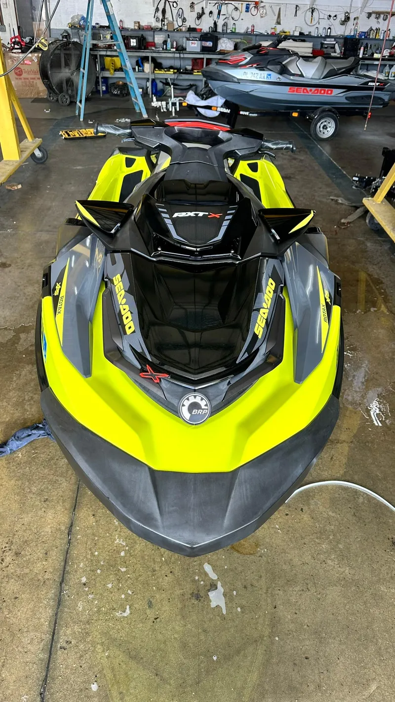 Slide: The Image of 2018 Sea-Doo RXT-X 300 jet ski in a workshop. - 7