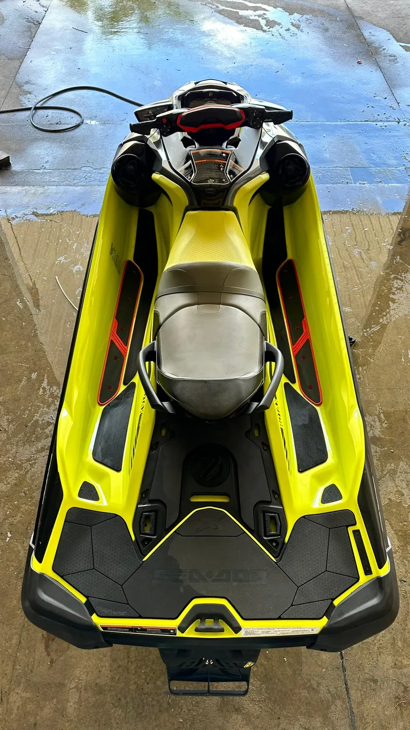 Slide: The Image of 2018 Sea-Doo RXT-X 300 jet ski in yellow and black, top view. - 8
