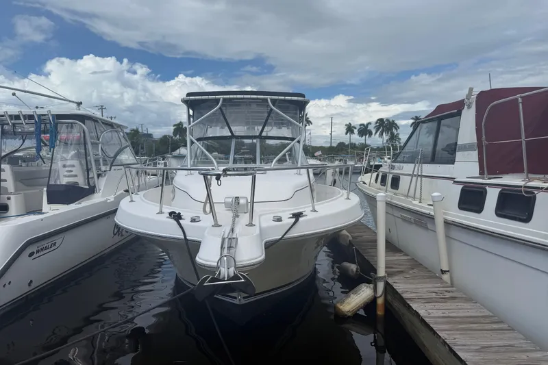 Slide: The Image of 2004 Pro-Line 30 Express Walkaround boat interior with seating and storage compartments. - 35