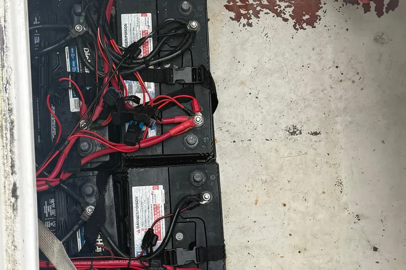 Slide: The Image of 2004 Pro-Line 30 Express Walkaround boat interior with helm and seating area. - 37