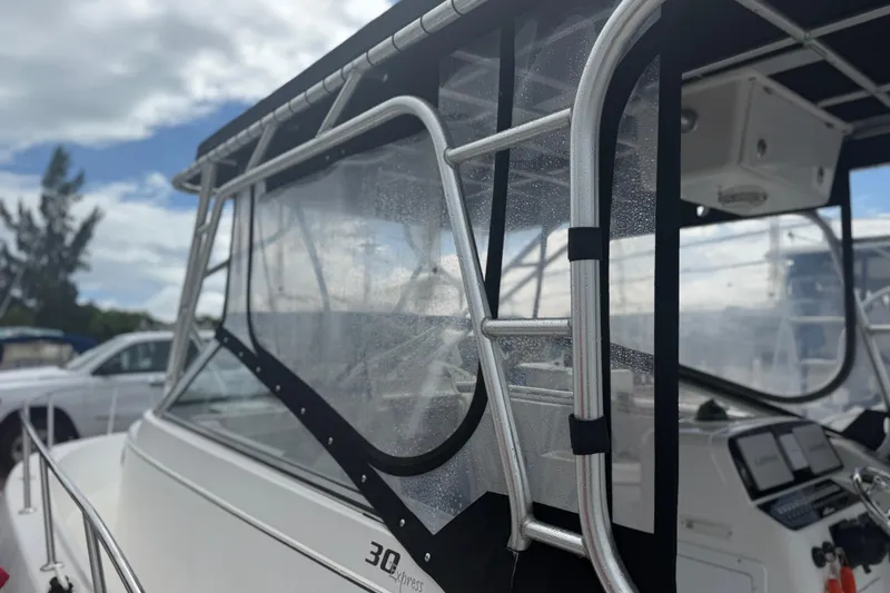 Slide: The Image of 2004 Pro-Line 30 Express Walkaround boat anchor and bow detail. - 47