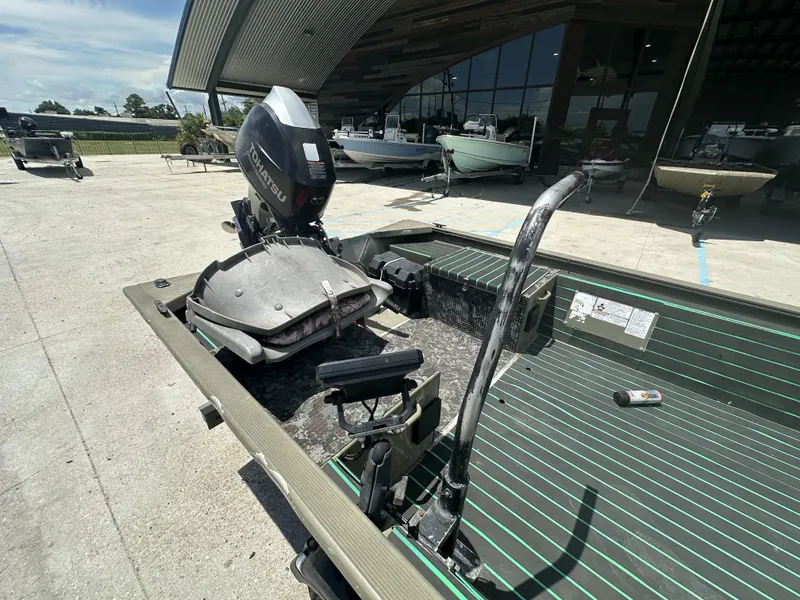 Slide: The Image of 2016 Tracker 1648 boat with Tohatsu outboard motor in a showroom. - 8