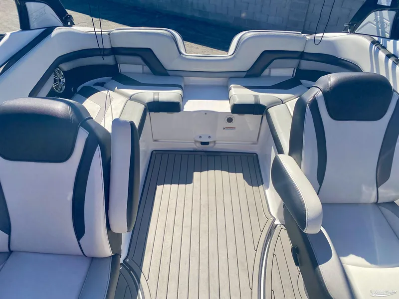 Slide: The Image of Interior of a 2017 Yamaha Boats 242X, featuring sleek seating and modern design. - 4