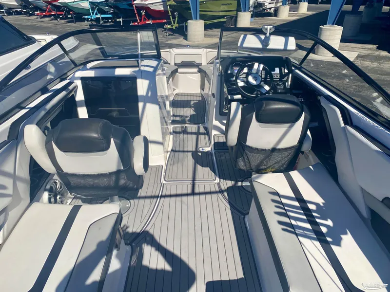 Slide: The Image of Interior of a 2017 Yamaha Boats 242X, featuring dual captain's chairs and sleek design. - 6